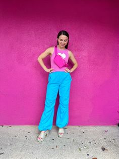 The cutest and more adorable tank top ever!! The perfect shade of pink with the cutest white heart in the middle makes this our favorite tank top of the summer! Style with greens, blues, neutrals- allllllll the colors!! We love styling this tank with skirt and shorts, but they look GREAT with fun pants, jeans, and layered with cardigans! True to size. 70% Rayon 30% Polyester Pink tank top with a cute white heart Style with blues, pinks, oranges, and greens Wear with shorts, skirts, jeans, and fu Businesses Photoshoot, Houston Photoshoot, Rainbow Closet, Colorful Summer Outfits, Colorful Photoshoot, Rainbow Clothes, Outfits Colorful, Photoshoot Summer, Colorful Clothes