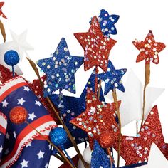 red, white and blue stars are on sticks