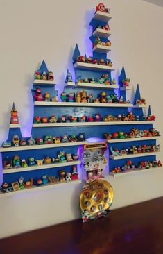 a wall with shelves filled with legos and other toys on it's sides