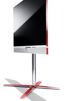 a flat screen tv sitting on top of a metal stand