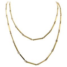 Beautifully 1980s 18 karat yellow gold long chain necklace. Measuring 39.5 inches in length it can be casually worn at full length or doubled up as a choker. Elongated rectangular bar links are flexibly connected to oval rings letting the bars turn and catch the light giving this necklace a charming lively effect. Luxury Yellow Gold Bar Necklace Fine Jewelry, Luxury Long Drop Necklaces With Adjustable Chain, Luxury Everyday Necklace With Rectangular Links, Luxury Double Strand Classic Chain Necklace, Luxury Yellow Gold Chain Necklace With Rectangular Links, Luxury Minimalist Necklace With Rectangular Links, Luxury Yellow Gold Bar Necklace With Adjustable Chain, Gold Long Chain, Long Chain Necklace