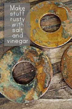 three rusty metal plates sitting on top of a wooden table with the words make stuff rusty with salt and vinegar