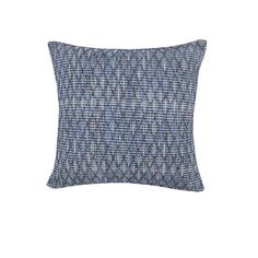 a blue and white pillow on a white background