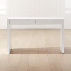 a white table sitting on top of a hard wood floor