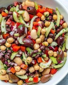 a white bowl filled with beans and veggies