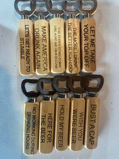 six bottle openers with different types of keys attached to them