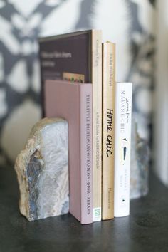 three books are stacked on top of each other