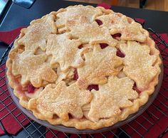 a pie sitting on top of a metal rack