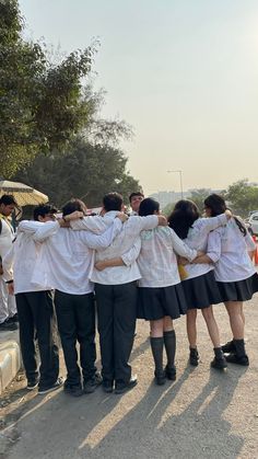 a group of young people standing next to each other