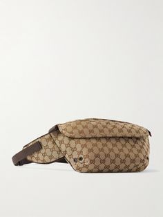 Gucci's 'GG' motif has been at the forefront of its collections since the early '60s. This belt bag is made from monogrammed canvas and has a padded strap with a polished silver buckle. Inside, there's room for everything you'll need on a day out, like your phone, wallet and sunglasses. Vintage Gucci Monogram Canvas Shoulder Bag, Brown Leather Gucci Belt Bag, Gucci Brown Leather Belt Bag, Gucci Leather Belt Bag With Removable Pouch, Luxury Travel Belt Bag With Logo, Gucci Belt Bag With Removable Pouch For Travel, Brown Monogram Canvas Belt Bag With Gold-tone Hardware, Classic Monogram Canvas Belt Bag With Removable Pouch, Classic Brown Monogram Canvas Belt Bag