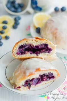 two blueberry pastries on a white plate