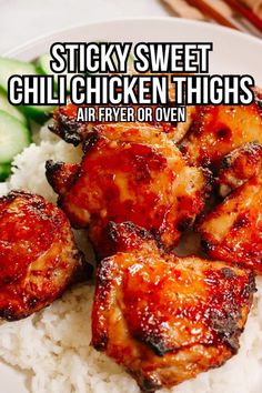 chicken thighs on top of rice with cucumbers in the background and text overlay that reads sticky sweet chili chicken thighs air fry or oven