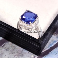 "Stone Name = Lab Created Tanzanite Gemstone color = Blue Stone Shape = Cushion Cut Stone Size = 10X10 mm Quality :- AAA Metal:- 925 Sterling silver Handmade Jewelry Ring JEWELRY RING FOR ALL OCCASION Don't miss this opportunity to own this beautiful Gemstone RING Your order will be handmade and ready for shipment in 3 to 5 Business days. Normally we ship via DHL eCommerce it takes 3 to 4 weeks if you need faster delivery You can select Shipping in your cart. AFGEMSNJEWELLERY https://www.etsy.co Silver Cushions, Tanzanite Engagement Ring, December Birthstone Ring, Silver Handmade Jewelry, Handmade Jewelry Ring, Tanzanite Stone, Tanzanite Ring, Sterling Silver Jewelry Handmade, Tanzanite Gemstone