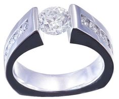 a white diamond ring with black band and diamonds on the sides, set in 18k white gold