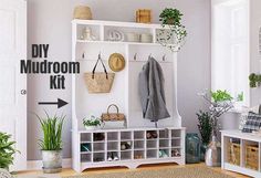 a white entryway with storage and plants