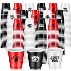 many different colored cups with black and red lids