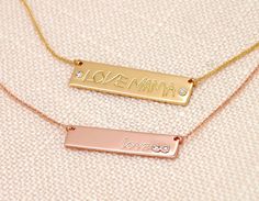 This is a solid 14K gold name necklace bar that comes in two sizes: 1.25 in wide and 0.33 in tall -  (longer chains are available at the drop down menu) 1.5 in wide and 0.4 in tall -  (longer chains are available at the drop down menu) To add a diamond + $45 (in the drop down menu) To add a colored gemstone + $20(in the drop down menu) To add more birthstones https://etsy.me/31k4A1z To add more diamonds https://etsy.me/318joQF Important: ● This is not laser engraving on the surface, all letters are deeply carved in the metal so they won't rub off. ● This is not stamping, so I can use your handwriting, signature, drawing or logo. 14K gold plate could be cast in yellow gold, rose or white gold, price stays the same. It is also available in 18K. This is a custom made necklace, it is not cut o Gold Engraved Bar Necklace For Mother's Day, Engraved Gold Bar Necklace For Mother's Day, Gold Rectangular Necklaces With Engraved Text, Gold Rectangular Necklace With Engraved Text, Gold Rectangular Pendant With Engraved Text, Mother's Day Engraved Gold Bar Necklace, Gold Nameplate Bar Necklace For Mother's Day, Personalized Gold Bar Necklace With Name, Personalized Gold Bar Necklace For Mother's Day