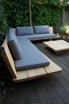 a couch sitting on top of a wooden deck