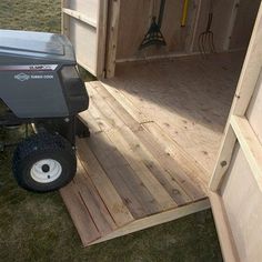 a small trailer that is sitting in the grass