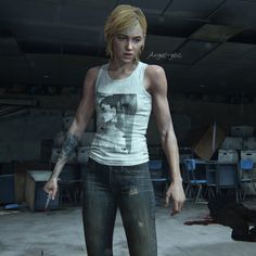 a woman standing in an empty room with tattoos on her arm and leg, holding a knife