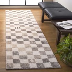 a white and gray rug in a living room