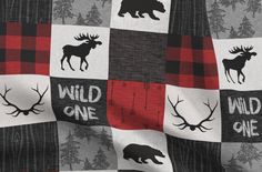 an image of a blanket with moose and deer numbers on the front in red, black, gray and white