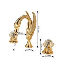 the golden sink faucet is shown with an angel design and crystal knobs