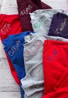 This embroidered crew neck sweatshirt, is personalization on the left side of the collar. Choose from your mascot, name, saying or anything that will fit.  Great for a personalized sports season, Christmas gift, girls trip, birthday gift, mama, grandma or school spirit. Choose from ADULT or YOUTH sizes.  Sweatshirt is a unsex size either Hanes or Gildan, whichever is in stock. *A picture of all the letters of this font are in the listing photos. I will use the lower and uppercase letters you pro Embroidered Stitches, Team Sweatshirts, Monogram Sweatshirt, Matching Sweatshirts, Dance Team, Dance Teams, Notch Collar, Uppercase Letters, Branded Sweatshirts