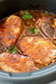 some meat is cooking in a slow cooker