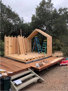 a house being built on top of a wooden deck