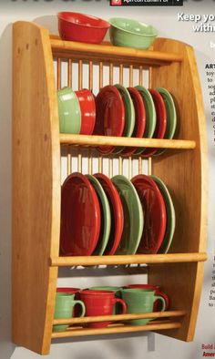 a wooden rack with plates and cups on it