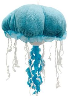 a blue jellyfish stuffed animal with chains hanging from it's back