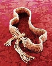 a pair of boots sitting on top of a red floor next to a rug with white lace