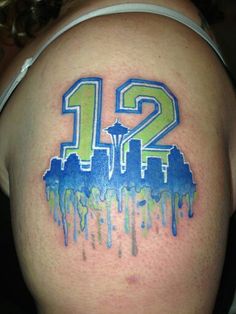 a tattoo with the number twelve painted on it