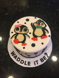 there is a cake with two penguins on it that says waddle it be?