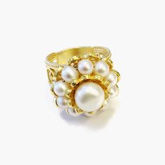 Double Layer Pearl 14K Gold Ring 925 Sterling Exceptionally Beautiful Design Pearl Ring, Feminine Ring, Valentine Gift Boxed, Mom's Gift Ring. IT WEIGHTS APPROXIMATELY 10 GR. 4-5 mm Pearls surround Center : 10 mm Round pearl for a feminine artistic look.. Made in an artisan workshop by an artist with 20+ Years experience. This a very Victorian, Artistic Ring that has sold out many times in England, Italy, Germany and the US. The Filigree band is tapered for comfortable wear. This will come in a White Heirloom Cluster Ring For Formal Occasions, Formal White Heirloom Cluster Ring, Elegant Adjustable Dome Ring For Anniversary, Timeless Handmade Jewelry For Wedding, Handmade Timeless Jewelry For Wedding, Elegant Dome Ring For Anniversary With Hallmark, Adjustable Elegant Yellow Gold Dome Ring, White Dome Ring Fine Jewelry, Luxury White Filigree Ring For Wedding