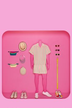 a pink tray with clothes, shoes and a measuring tape on it's side