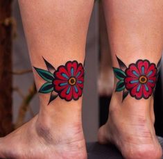 two people with tattoos on their feet and one has a flower tattoo on the ankle