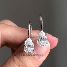 Pear Cut Moissanite Earrings, Solitaire Dangle Drop Custom Earrings, Pear Dangle Earrings For Wife, Daily Wear Simple Earrings. 𝐌𝐚𝐢𝐧𝐒𝐭𝐨𝐧𝐞𝐃𝐞𝐭𝐚𝐢𝐥𝐬 ➤𝐓𝐲𝐩𝐞: Moissanite ➤𝐂𝐮𝐭: Pear ➤𝐂𝐨𝐥𝐨𝐮𝐫: FG ➤ 𝐂𝐥𝐚𝐫𝐢𝐭𝐲: VVS1 ➤ 𝐖𝐞𝐢𝐠𝐡𝐭: 3.00 CT (approx) 𝐑𝐢𝐧𝐠 𝐃𝐞𝐭𝐚𝐢𝐥𝐬 At BlueMoon Jewels, we use only the highest quality materials to craft our beautiful jewelry. Our pieces are made with solid gold in your choice of 10k, 14k, or 18k purity, or with 925 sterling silver. We Engagement Earrings, Solitaire Earrings, Diamond Dangle Earrings, Moissanite Earrings, Beautiful Engagement Rings, White Gold Earrings, Custom Earrings, Pear Diamond, Simple Earrings