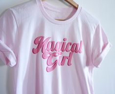 "Kawaii Magical Girl Shirt * eco-friendly water-based ink * see below for size info * printed in my USA loft * 100% cotton   * machine wash cold inside out is best * allow 1-3 business days if not in stock UNISEX tshirt finished chest * XS . 34-35 / 86-89cm * S . . 36-38\" / 94-97cm * M . .40-42\" / 101-107cm * L . . 43-44\" / 109-112cm * XL . 46-48\" / 117-122cm  * 2XL 50-52\" / 127-132cm * 3XL 54-56\" / 137-142cm T-SHIRT size medium shoulder to bottom length: 28-29\"/74cm RINGER size medium shoulder to bottom length: 28-29\"/74cm  *size & length varies by brand shirt currently in stock *most women & Non-Binary feminine bodies size down ©Espi Lane. All Rights Reserved. www.etsy.com/shop/EspiLane www.espilane.com WARNING If you are seeing this text somewhere other than espilane.com or my E Kawaii Tshirt, Fairy Moon, Magical Girl Outfit, Cute Tshirt, T Shirt Styles, Sailor Shirt, Japanese Shirt, Kawaii Shirts, Moon T Shirt