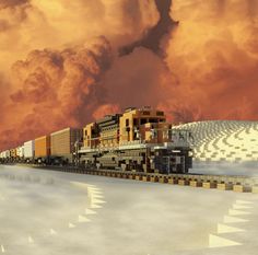 a train traveling down tracks next to a building under a cloudy sky with orange clouds