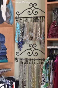 a closet filled with lots of necklaces and jewelry