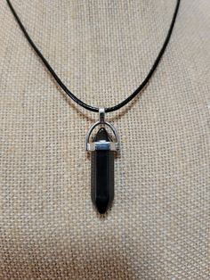 "Black Obsidian crystal pendant on a 20\" black cord adjustable necklace" Black Crystal Pendant, Obsidian Crystal Necklace, Casual Black Jewelry With Adjustable Cord, Adjustable Black Onyx Crystal Necklace, Black Crystal Necklace With Adjustable Cord, Minimalist Black Pendant Crystal Necklace, Minimalist Black Adjustable Crystal Necklace, Adjustable Black Crystal Pendant Necklace, Minimalist Adjustable Black Crystal Necklace