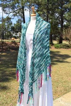 This lovely triangle shaped, fringed crochet shawl, wrap or oversized scarf will be made to order in your color choice.  NOTE:  IF YOU WOULD LIKE MULTI-COLOR, PLEASE LIST COLORS IN THE NOTES WHEN ORDERING AND I'LL SEND YOU COLOR SAMPLE TO CHOOSE FROM. 🌞 USES: With an outfit for everyday wear. For a bride or bridesmaids. Over a festive outfit to a holiday event, wedding, party, luncheon, cruise or evening out. On the beach!! As a skirt wrap or sari style wrap. 🌞 SIZE & SHAPE:  60 - 70 inches wi Spring Festival Crochet Shawl, Crochet Shawl For Spring Festival, Bohemian Crochet Lace Shawl For Spring, Bohemian Shawl With Crochet Lace, Bohemian Hand Knitted Shawl For Festival, Bohemian Festival Hand Knitted Shawl, Green Bohemian Handwoven Shawl, Spring Bohemian Crochet Shawl, Bohemian Crochet Shawl In Acrylic Yarn