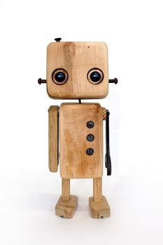 a wooden toy with two eyes and a cane in his hand, on a white background