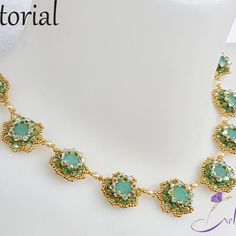 a necklace with green stones is shown on a mannequin neckline and has gold chain