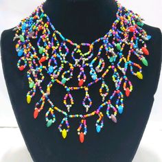 Signature Studio Multi-Color Beaded Necklace, A Vibrant Statement Piece Featuring Four Intricately Layered Strands. Each Layer Is Adorned With A Variety Of Colorful Beads, Creating A Dynamic And Eye-Catching Design. With A 21-Inch Base Length And A 3-Inch Extender, This Necklace Offers Versatile Styling Options. Perfect For Elevating Both Casual And Formal Outfits, It Comes New On A Card, Making It Ideal For Gifting Or Adding To Your Personal Collection. Color Beaded Necklace, Aesthetic Jewellery, Studio Jewelry, Christmas String Lights, Formal Outfits, Formal Outfit, String Lights, Pink Red, Womens Jewelry Necklace