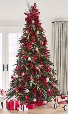 a decorated christmas tree with red and white ornaments