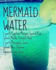 there is a mason jar filled with blue liquid next to a swimming pool and the words mermaid water written on it