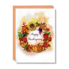 a happy thanksgiving card with autumn leaves and sunflowers in a wreath on the front